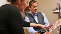 Dr. Arnold Advincula talking to a patient about common conditions of the uterus.